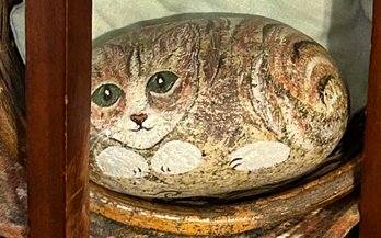 Artistically Painted Stone Depicting A Curled-Up Cat Resting In A Basket - 5.5 X 3.5'H