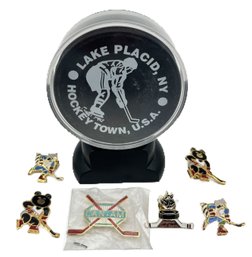 7 Pcs - Lake Placid Hockey Puck In Display Case And 6-Hockey Lapel Or Hat Pins