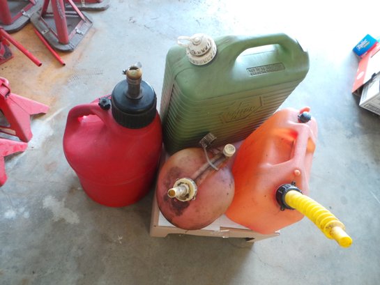 Lot # 7 -Gas Cans And 1 Water Jug - See Pics