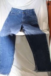 1 Pair Carhartt Jeans - 34x32 With Cuts At  Bottom Hems Of Legs And 1.5 Inch Cut At Top Of Left Leg On Back