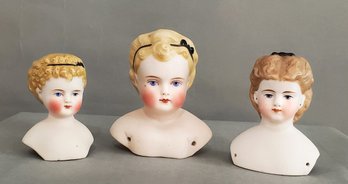 LOT OF 3 TINTED BISQUE DOLL HEADS